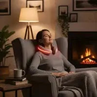 A person lies face down on a white treatment table with their back exposed, undergoing a non-contact procedure where a multi-armed medical device positioned above them projects green laser lights onto their lower back.