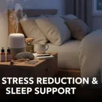 A calm and relxing bedroom atmosphere with a bed with cream bedding and a humdifier and cofee on the side table with a low ligthting.