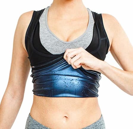 Person wearing a black and gray sports bra with a blue moisture-wicking layer on a white background
