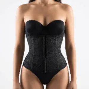 Black waist trainer worn by a model on a plain background