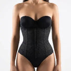 Black waist trainer worn by a model on a plain background