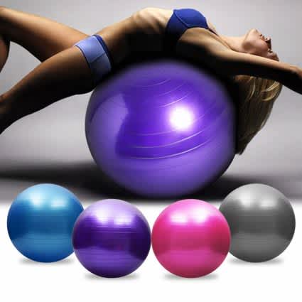 Woman lying on a purple exercise ball with additional balls in various colors displayed below.