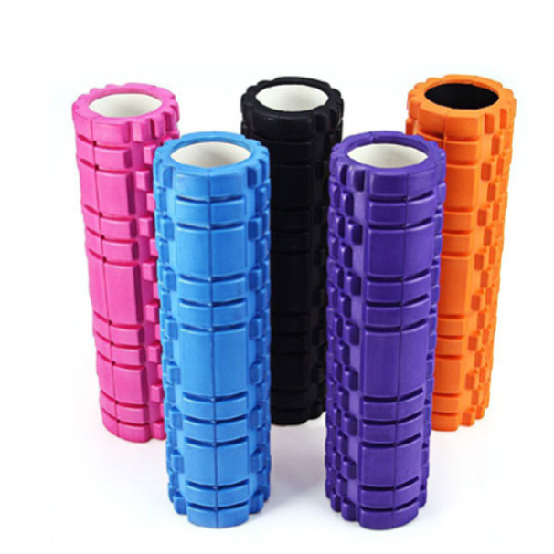 Five foam rollers in different colors on a white background