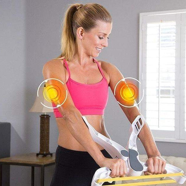 Woman using a shoulder exercise device in a living room. With Arms workout system at Corewell Collective